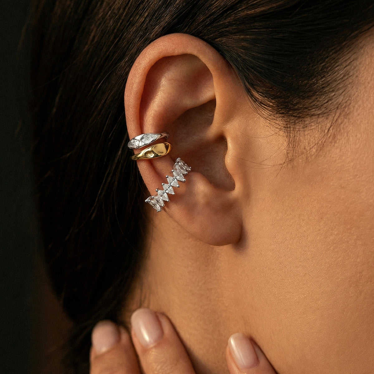 The Perfect Hoop Shop Cuffs collection image featuring gold and silver ear cuffs and crystal ear climber styled on ear