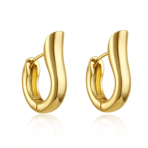 A pair of Bari Hoop earrings is displayed against a white background, the fishhook-shaped golden curves glistening in the light. 