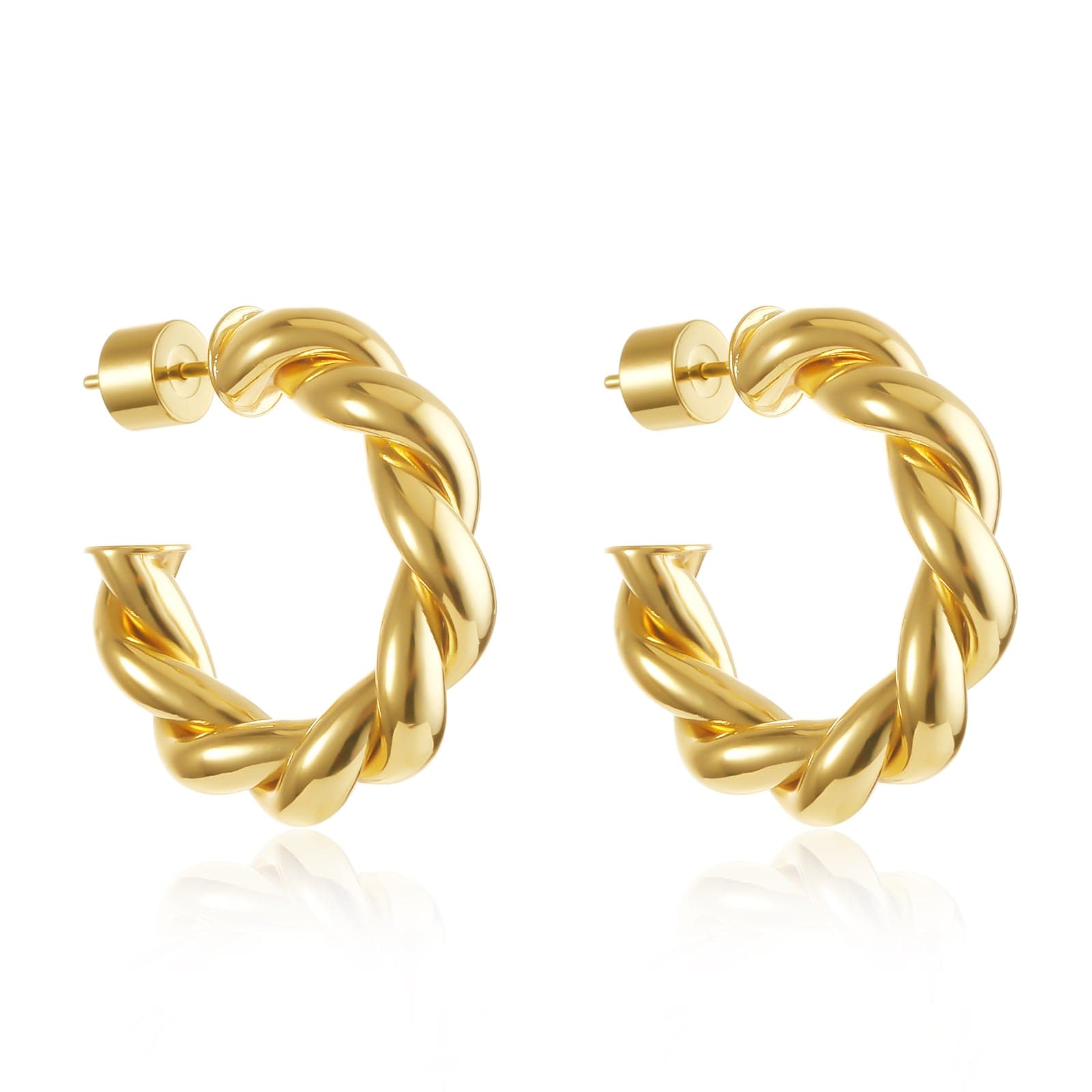 Front-facing image of the Cannes Hoop earrings against a white background, emphasizing the full 3D swirl structure. These 18K gold-plated hoops have a fluid, intertwined design with wide dimension and a signature open silhouette, secured with chunky gold cylinder backings.
