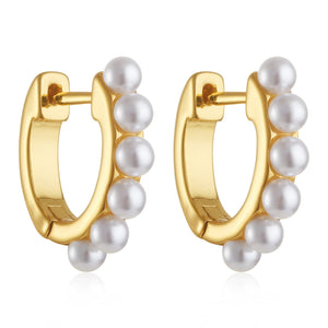The Perfect Hoop’s Chambery Huggie shown on white background – a striking blend of modern structure and traditional beauty, with perfectly placed pearls enhancing the sculpted 18K gold setting.