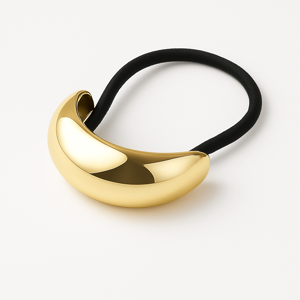 The Perfect Hoop Hair Hoop in gold, featuring a polished curved design, displayed flat on white background