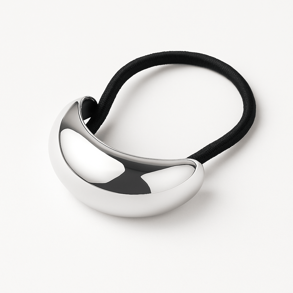 The Perfect Hoop Hair Hoop in silver, classic metallic loop with rounded form, shown in product flat lay