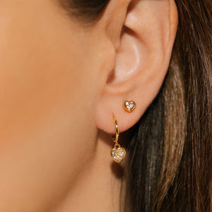 The Amore Solitaire Duo is worn as an earring stack, the Solitaire Stud adding a delicate accent as the Amore Drop Hoop gracefully dangles from her ear.  