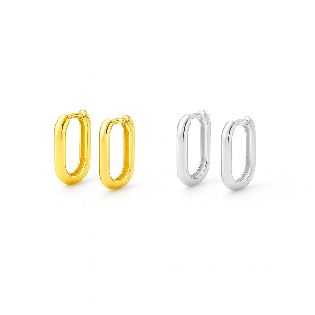 Two-tone Positano Huggie Earrings by The Perfect Hoop, featuring polished gold and silver finish on white background.