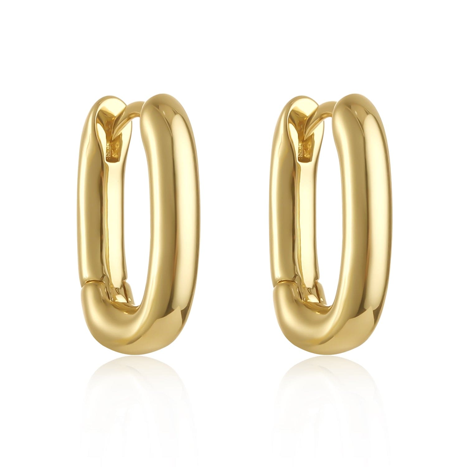 The Positano Hoop Mini in polished gold, photographed on a pure white background, featuring a bold oval shape and hinge closure mechanism.  By The Perfect Hoop.