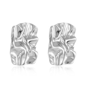 The Soleil Earring in Sterling Silver – textured silver sculptural earrings with a molten design on a clean white background