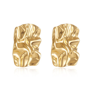 The Soleil Earring – gold crinkled sculptural earrings with a high-shine finish on white background