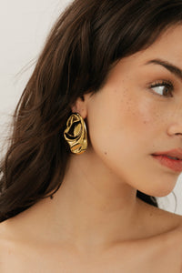 Close-up side profile of model showcasing the bold gold Portofino Earrings by The Perfect Hoop, styled with effortless elegance.