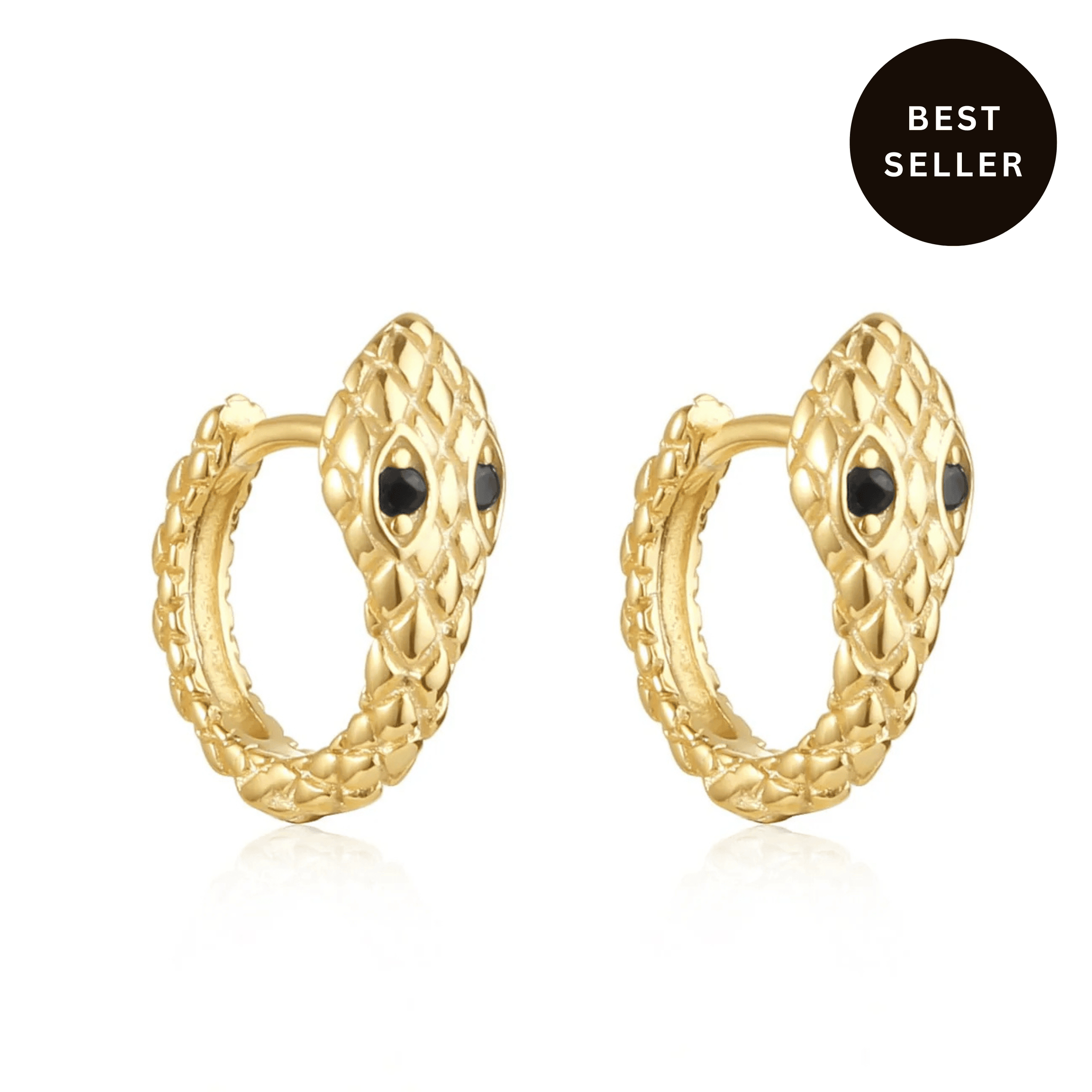 The Perfect Hoop Veleno Huggie in 18K gold with black crystal eyes, snake-inspired texture, shown on white background