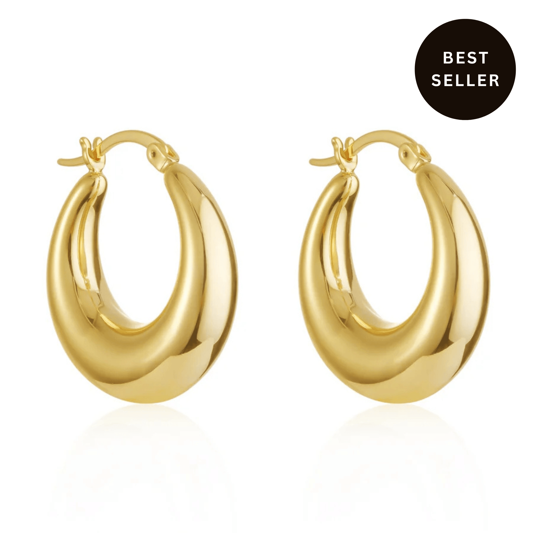 The Perfect Hoop Capri gold earrings on white background, thick sculptural twisted design with high-shine finish, bestselling bold hoops