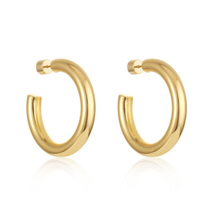 The Perfect Hoop by The Perfect Hoop on a pure white background, classic medium-sized gold open hoop earrings with a sleek polished finish.