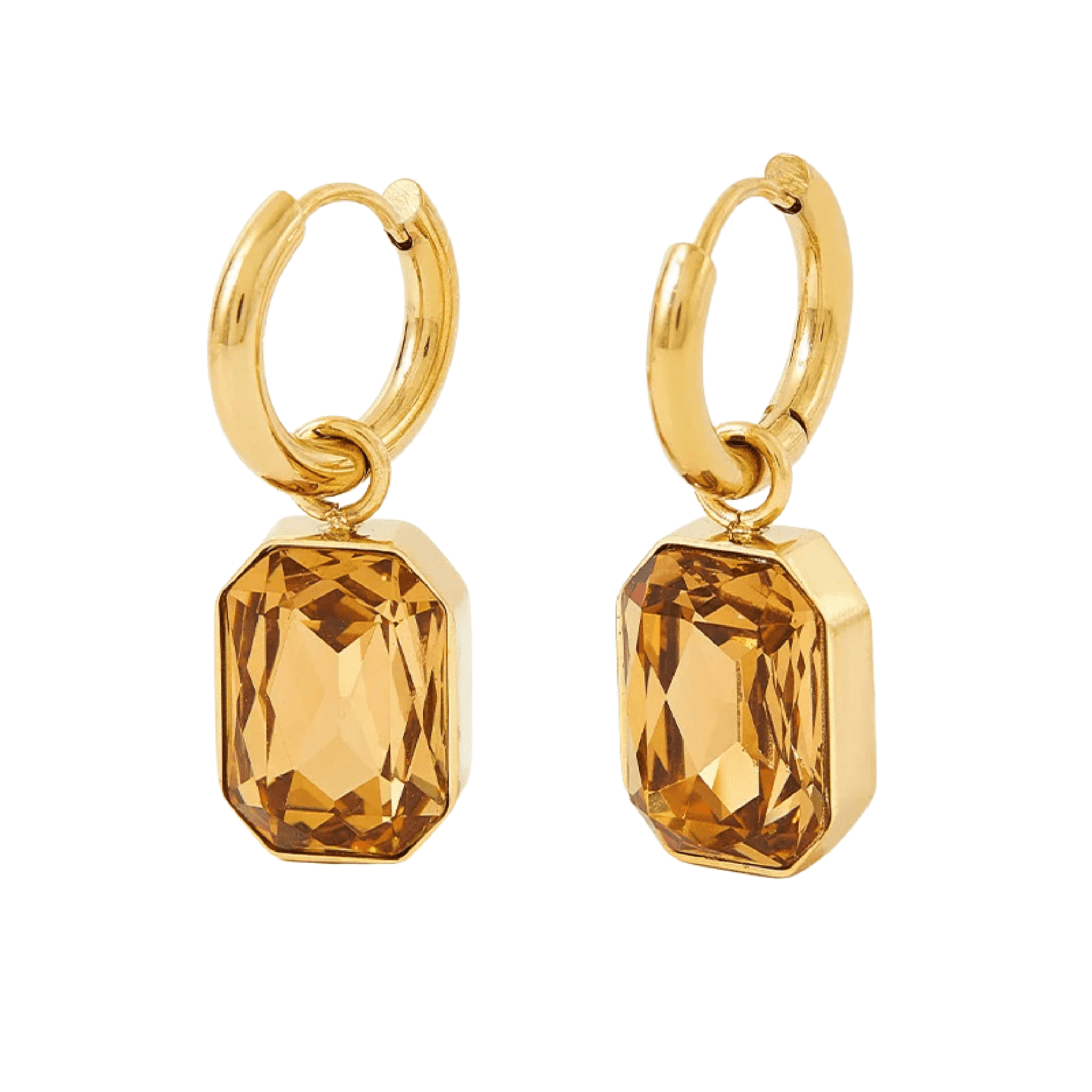 The Perfect Hoop Sahara Drop Hoop earrings in Desert Sand shown on white background. Warm amber-toned crystal drop set in gold-plated huggie hoop design.