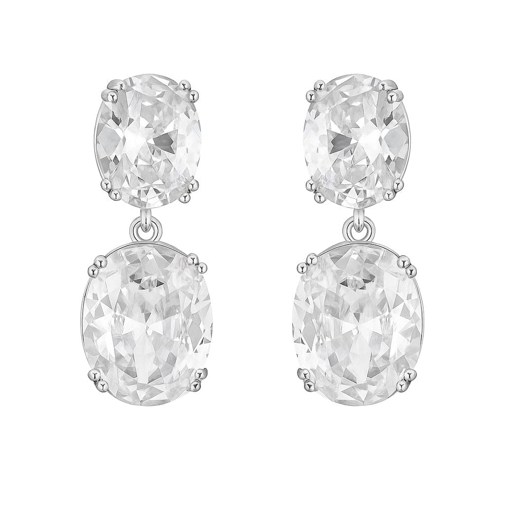 The Perfect Hoop Monaco Drop Hoop in silver, detailed statement crystal earrings earrings with clear oval gemstones on a white background