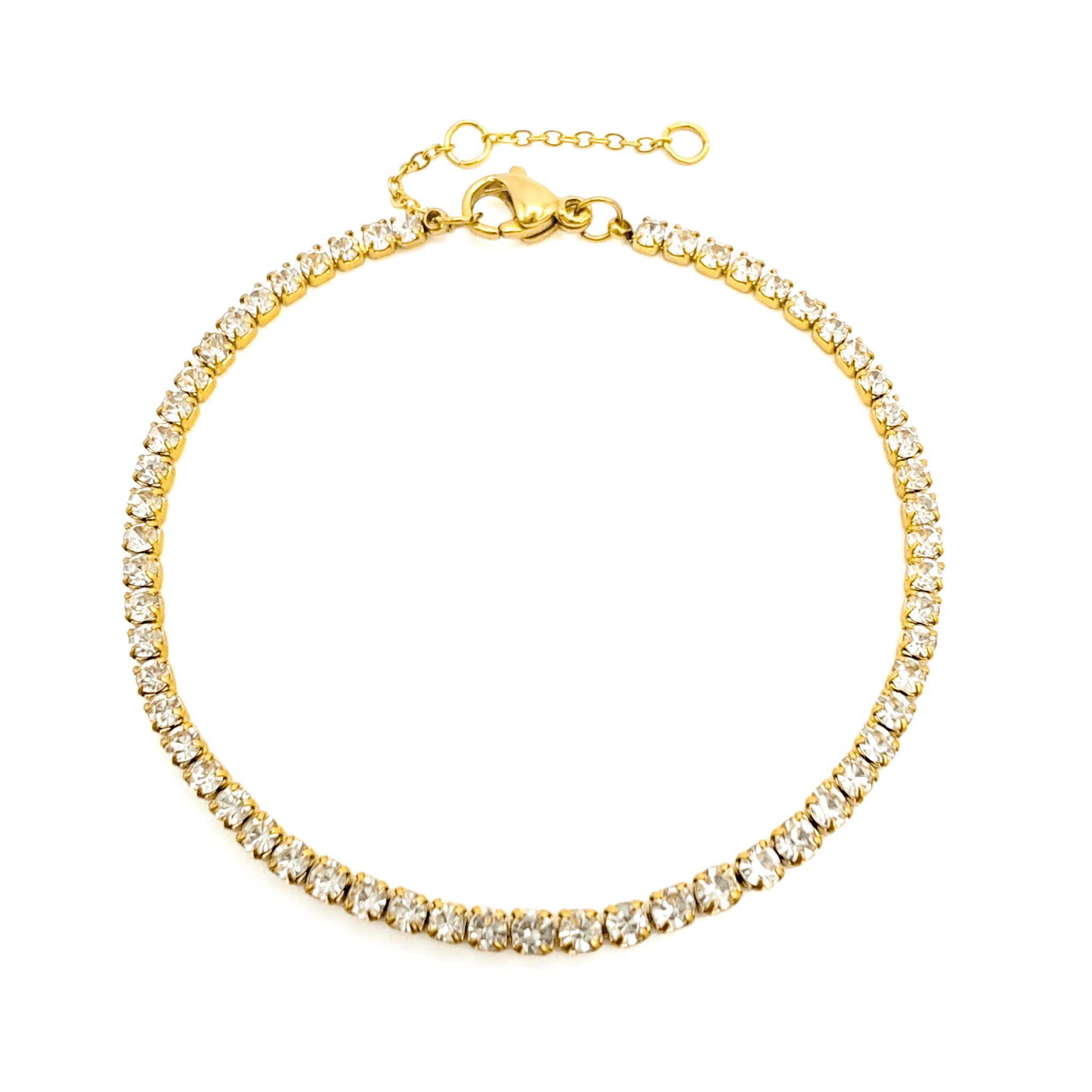 Gold tennis bracelet with clear stones on a white background by The Perfect Hoop.
