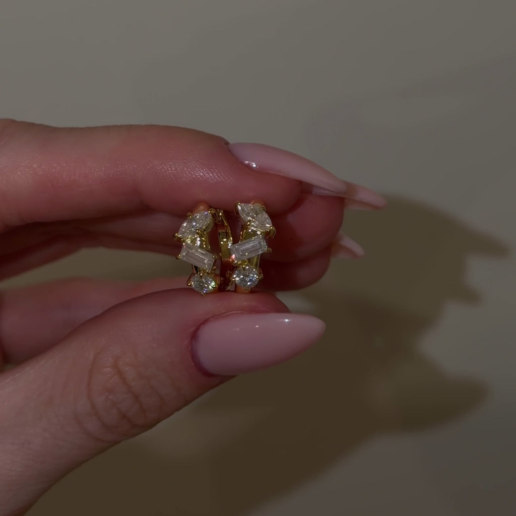 Video showcasing The Perfect Hoop Isabel Huggie | Luxe featuring D Color VVS1 marquise, emerald-cut, and round brilliant moissanite in 18K Gold Vermeil.