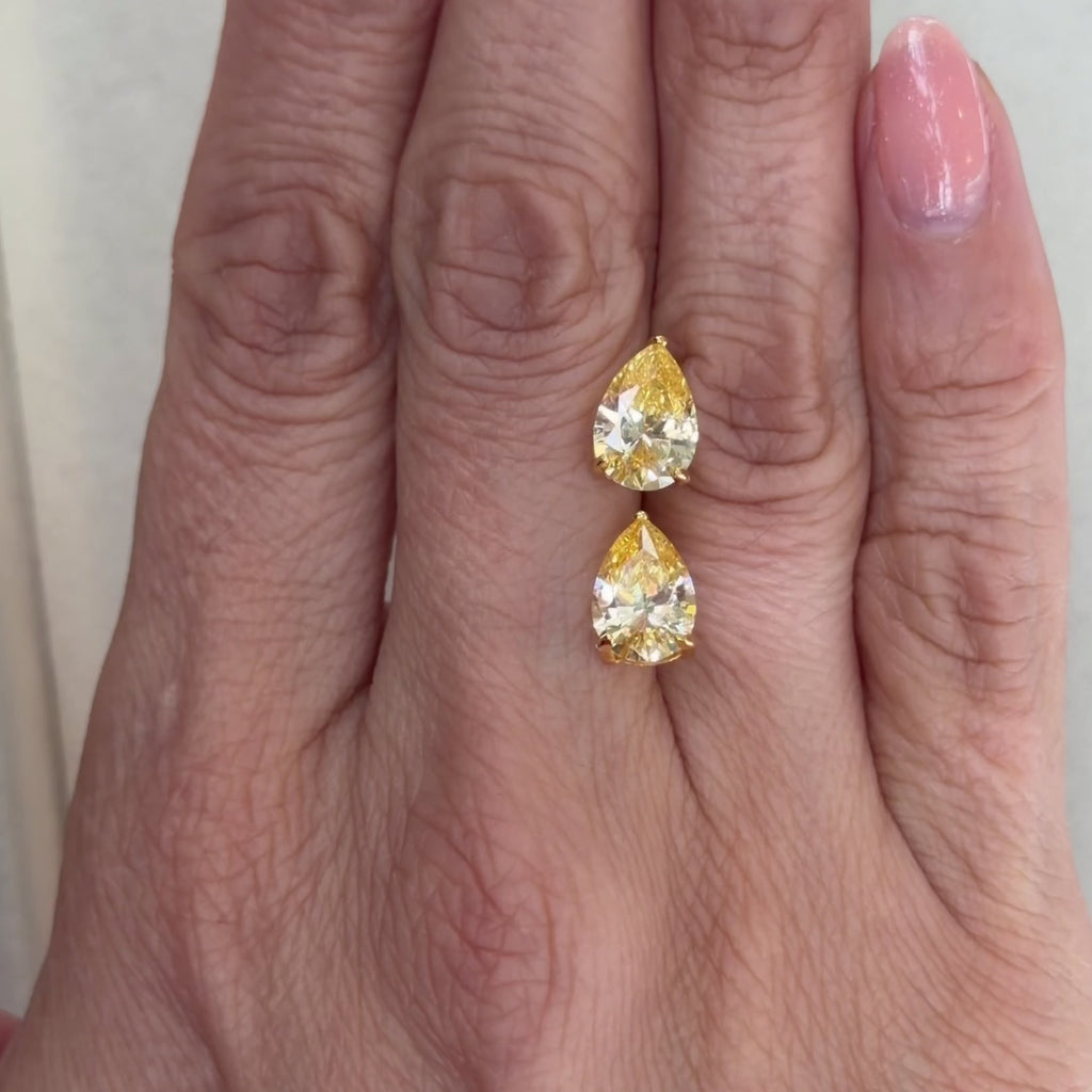Close-up of the Canary Pear Cut Stud by The Perfect Hoop showing the brilliant yellow pear cut stone and polished gold setting.