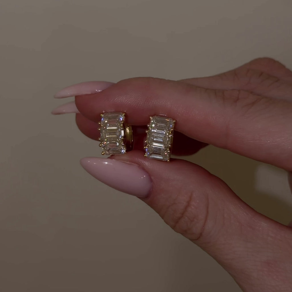 Video showcasing The Perfect Hoop Blaire Huggie | Luxe featuring emerald-cut D Color VVS1 moissanite in 18K Gold Vermeil.
